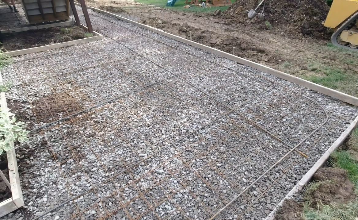 concrete patio preparation rebar gravel base installation