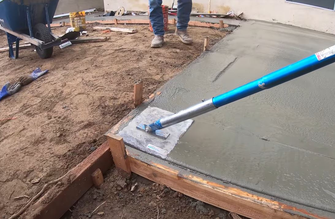 professional concrete finishing bull float smoothing wet surface