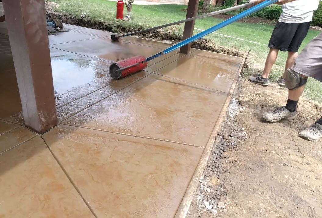 stamped concrete texture roller application professional patio installation